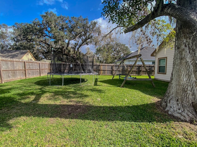 view of yard featuring a trampoline