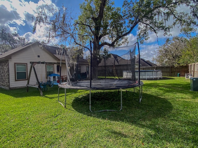 view of yard featuring a trampoline