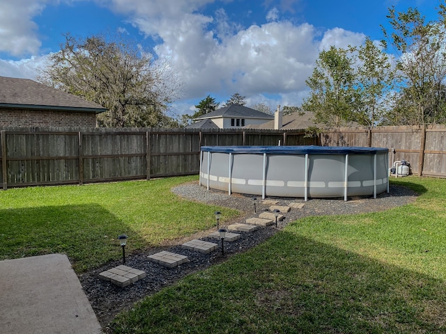 view of yard featuring a fenced in pool