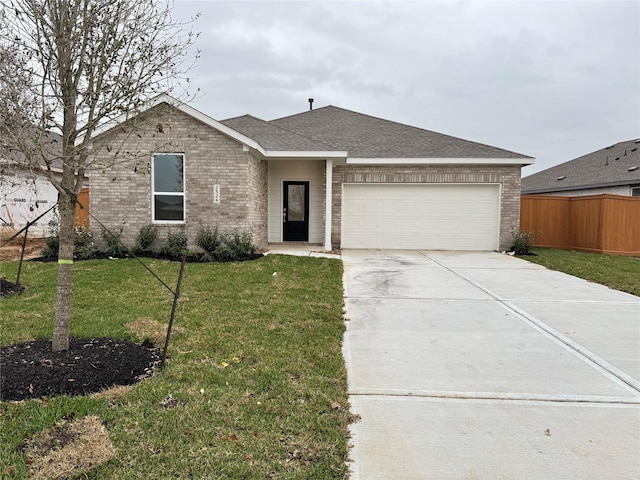 ranch-style home with a garage and a front yard