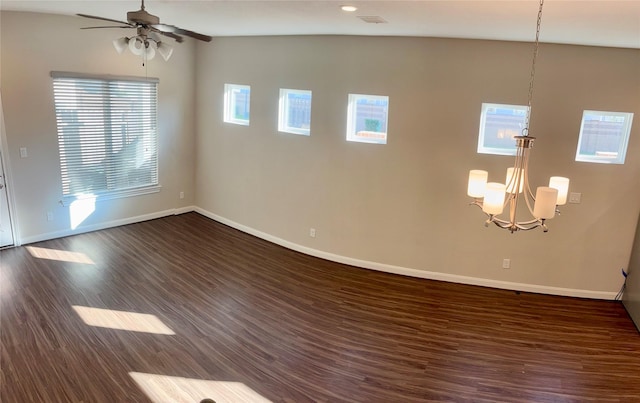 unfurnished room featuring ceiling fan with notable chandelier, lofted ceiling, and dark wood-type flooring