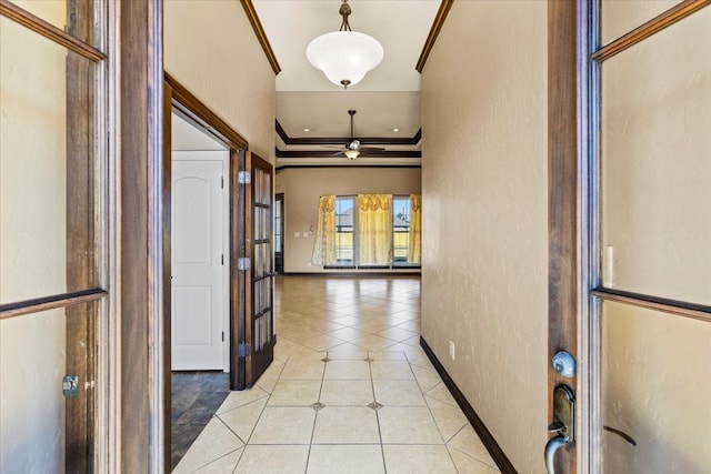 hall featuring ornamental molding and light tile patterned flooring