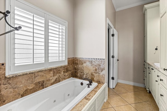 bathroom with tile patterned flooring, vanity, a bathtub, and ornamental molding