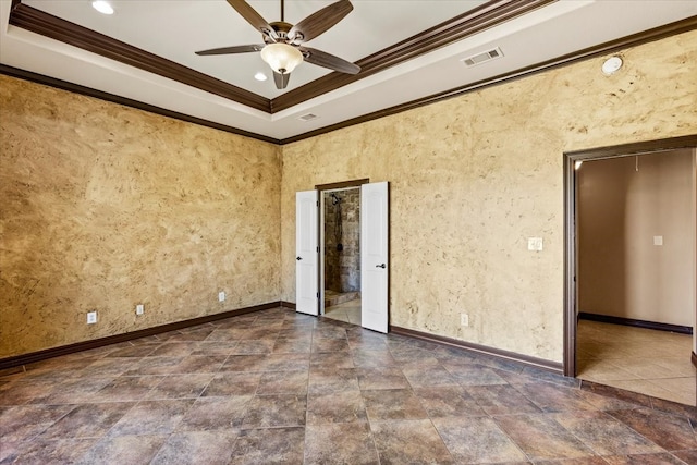 unfurnished bedroom featuring a tray ceiling, ceiling fan, and ornamental molding