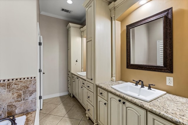 bathroom featuring tile patterned flooring, a bath, vanity, and ornamental molding