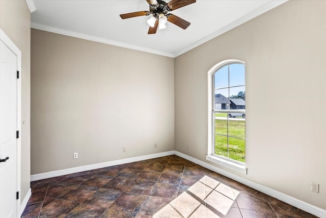 spare room with ceiling fan, a healthy amount of sunlight, and ornamental molding