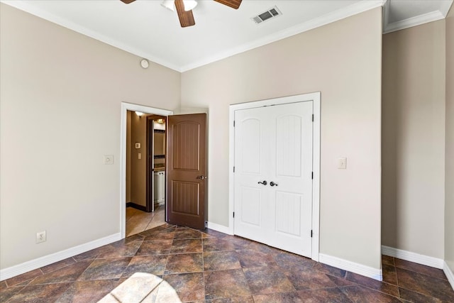 unfurnished bedroom with a closet, ceiling fan, and crown molding