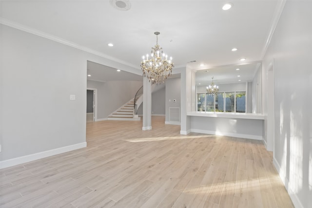 interior space featuring a notable chandelier, light hardwood / wood-style floors, and crown molding