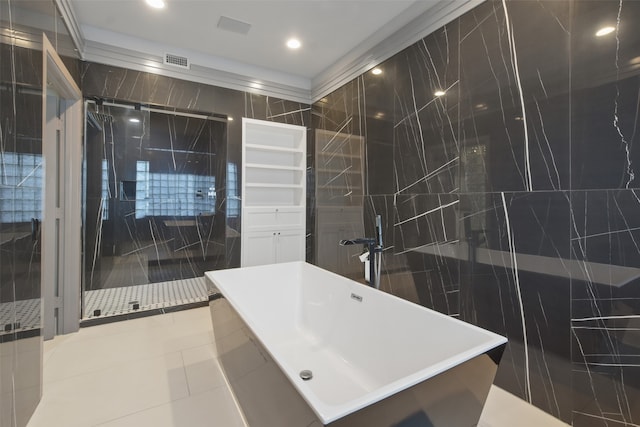 bathroom featuring tile patterned floors, independent shower and bath, and tile walls