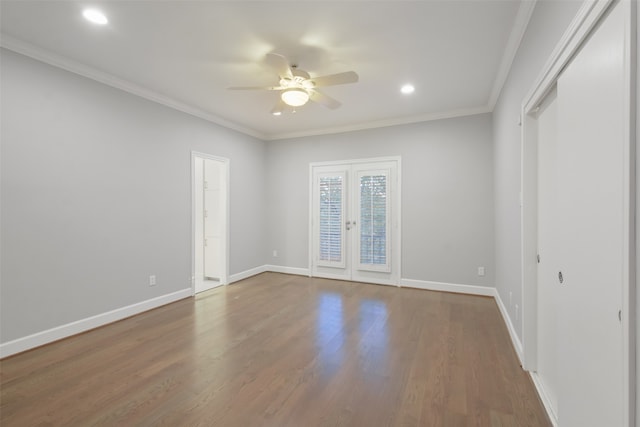 unfurnished room with ceiling fan, french doors, hardwood / wood-style floors, and ornamental molding