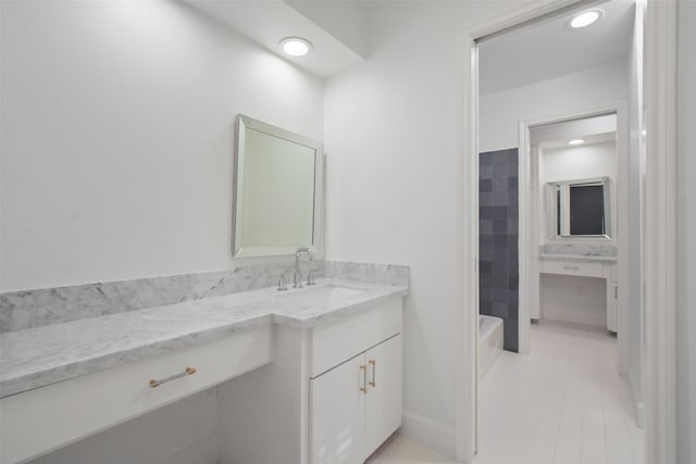 bathroom with tile patterned flooring and vanity