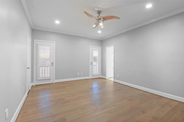 unfurnished room with light hardwood / wood-style floors, ceiling fan, and ornamental molding