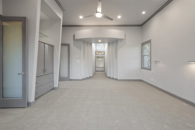 unfurnished bedroom with light colored carpet and crown molding