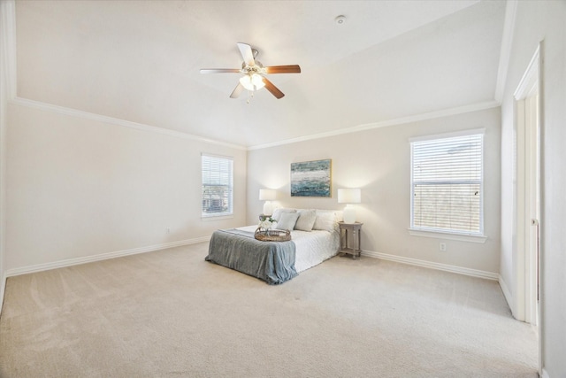 carpeted bedroom with ceiling fan and ornamental molding