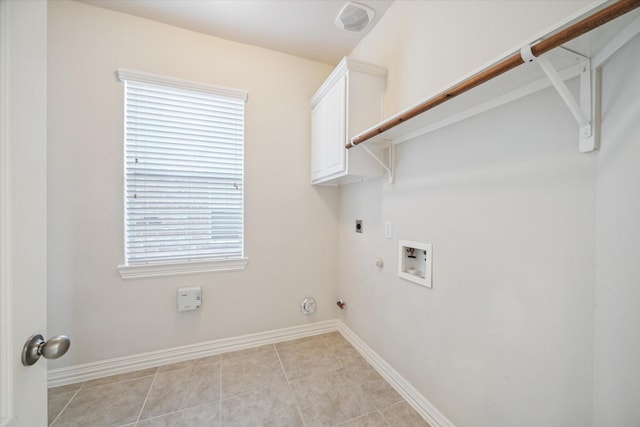 laundry room featuring cabinets, gas dryer hookup, washer hookup, light tile patterned floors, and hookup for an electric dryer