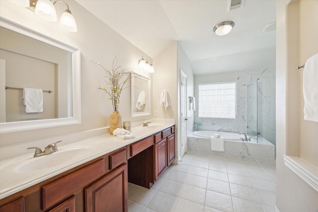 bathroom featuring vanity, tile patterned floors, vaulted ceiling, and separate shower and tub