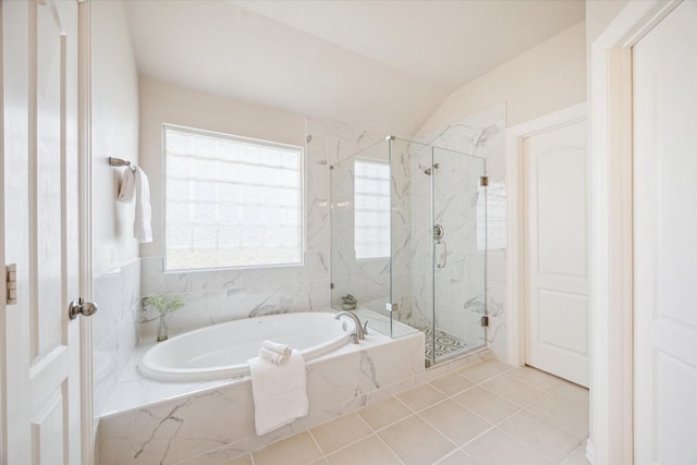 bathroom with tile patterned floors, lofted ceiling, and independent shower and bath