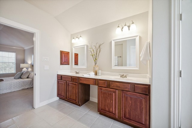 bathroom featuring tile patterned flooring, vanity, crown molding, and vaulted ceiling