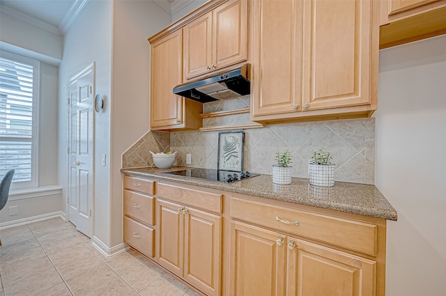 kitchen featuring backsplash, black electric stovetop, crown molding, light tile patterned floors, and light stone counters