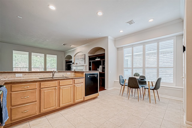 kitchen with ornamental molding, built in shelves, sink, light tile patterned floors, and black dishwasher