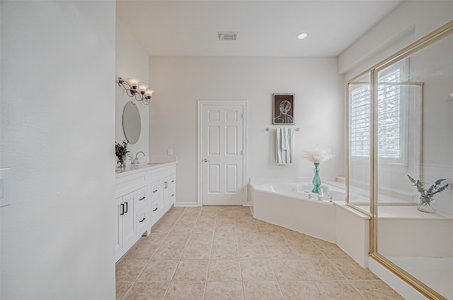 bathroom featuring vanity and a tub