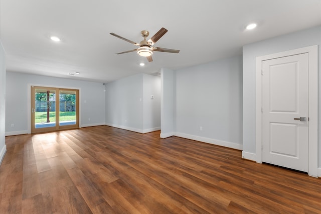 spare room featuring ceiling fan and dark hardwood / wood-style floors