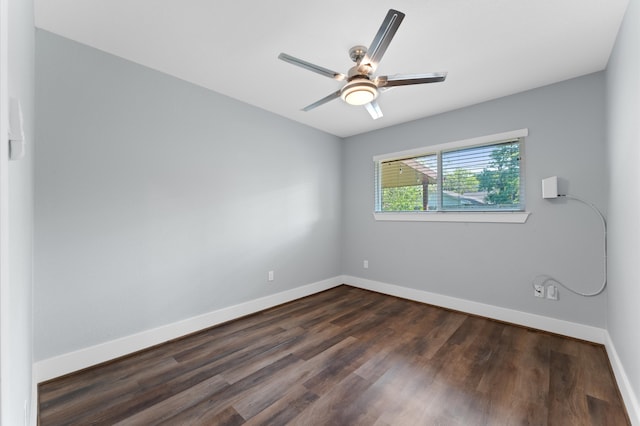 unfurnished room featuring ceiling fan and dark wood-type flooring