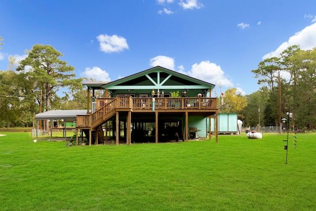 back of property featuring a lawn and a wooden deck