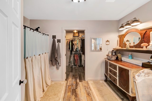 bathroom with wood-type flooring