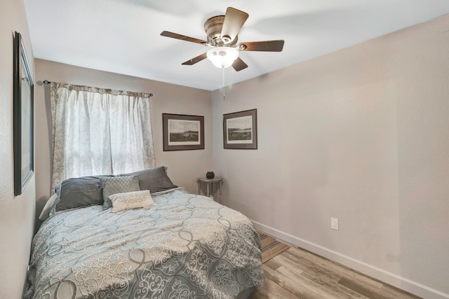 bedroom featuring ceiling fan and light hardwood / wood-style floors