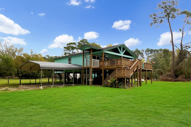 back of house featuring a yard, a carport, and a wooden deck