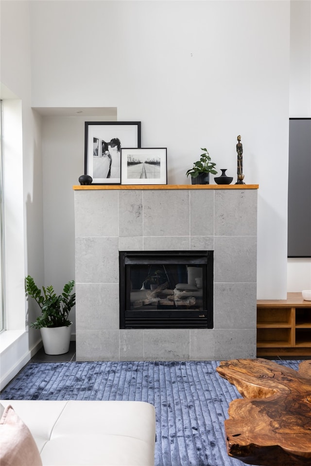 details featuring a tile fireplace