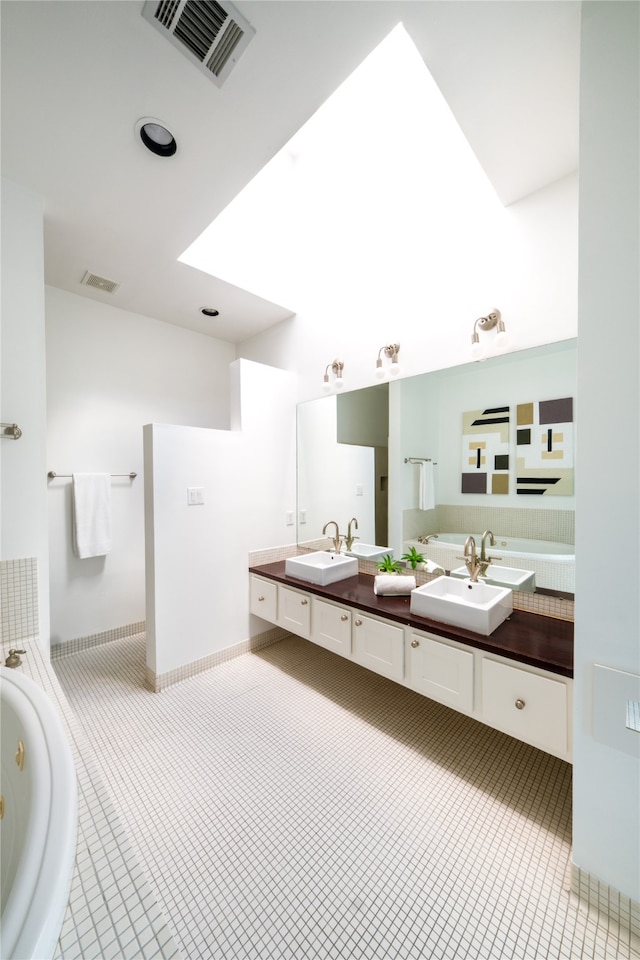 bathroom featuring a bathing tub and vanity