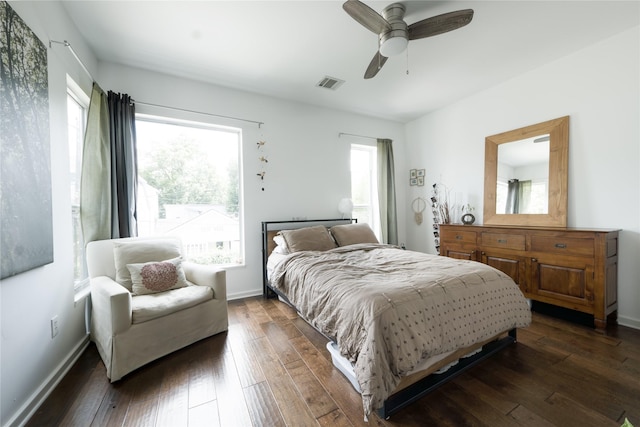 bedroom featuring dark hardwood / wood-style flooring and ceiling fan