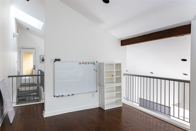 interior space featuring beam ceiling, dark wood-type flooring, high vaulted ceiling, and a skylight