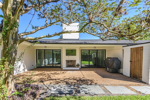 rear view of house featuring a patio area