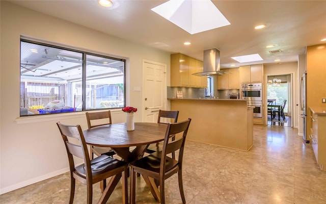 dining area featuring a skylight