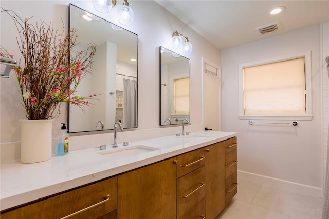 bathroom featuring tile patterned floors and vanity