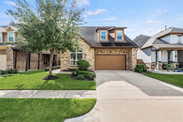 view of front of property featuring a front yard and a garage