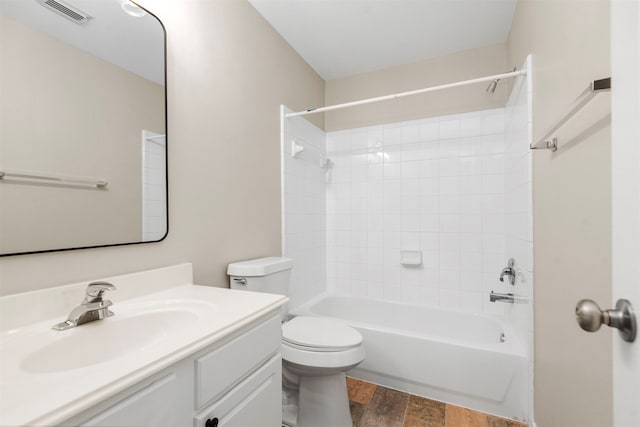 full bathroom featuring toilet, vanity, tub / shower combination, and hardwood / wood-style flooring