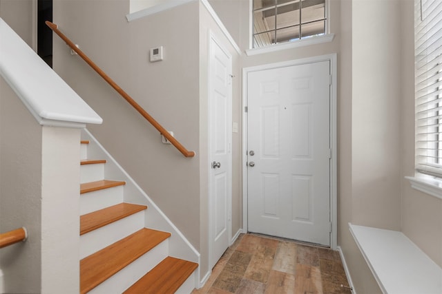 entryway with hardwood / wood-style floors