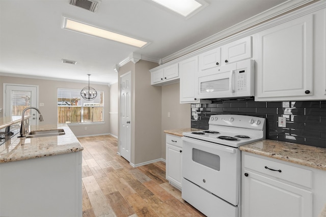 kitchen featuring white cabinets, light hardwood / wood-style floors, white appliances, and sink