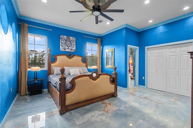 bedroom with ceiling fan and a closet