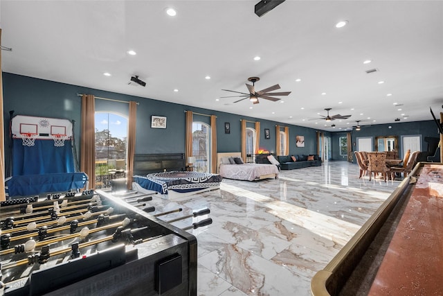 playroom featuring ceiling fan