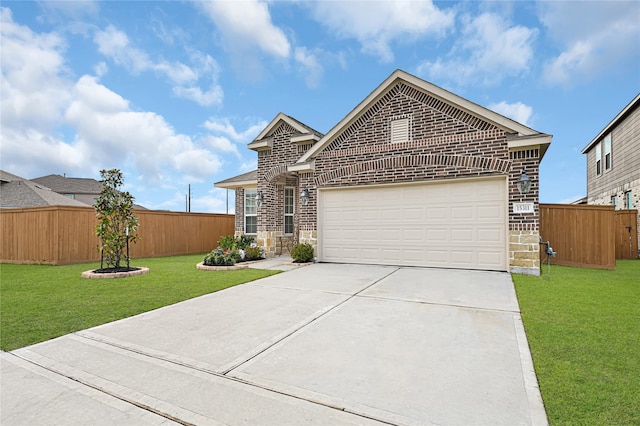 view of front of house with a garage and a front lawn