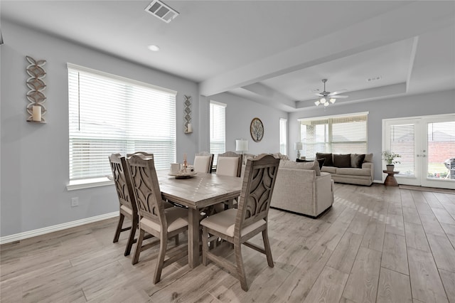 dining room featuring ceiling fan, light hardwood / wood-style floors, and a wealth of natural light