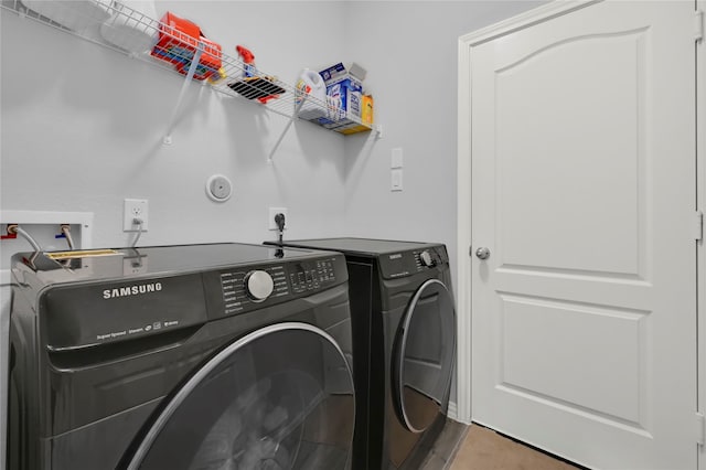 laundry room with separate washer and dryer