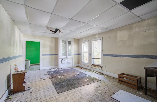 spare room featuring a drop ceiling