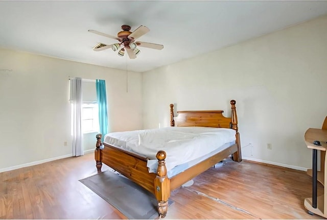 bedroom featuring ceiling fan, light hardwood / wood-style flooring, and billiards