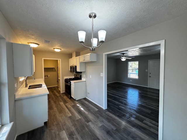 kitchen with white range, white cabinetry, sink, and dark wood-type flooring